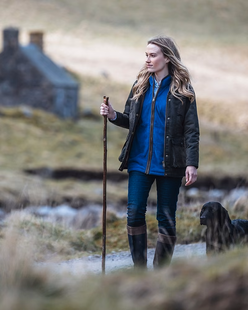 Hoggs of Fife Caledonia Ladies Waxed Jacket in Antique Olive, walking lifestyle view
