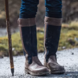 Dark Brown and Navy Cleveland II country boots worn outdoors
