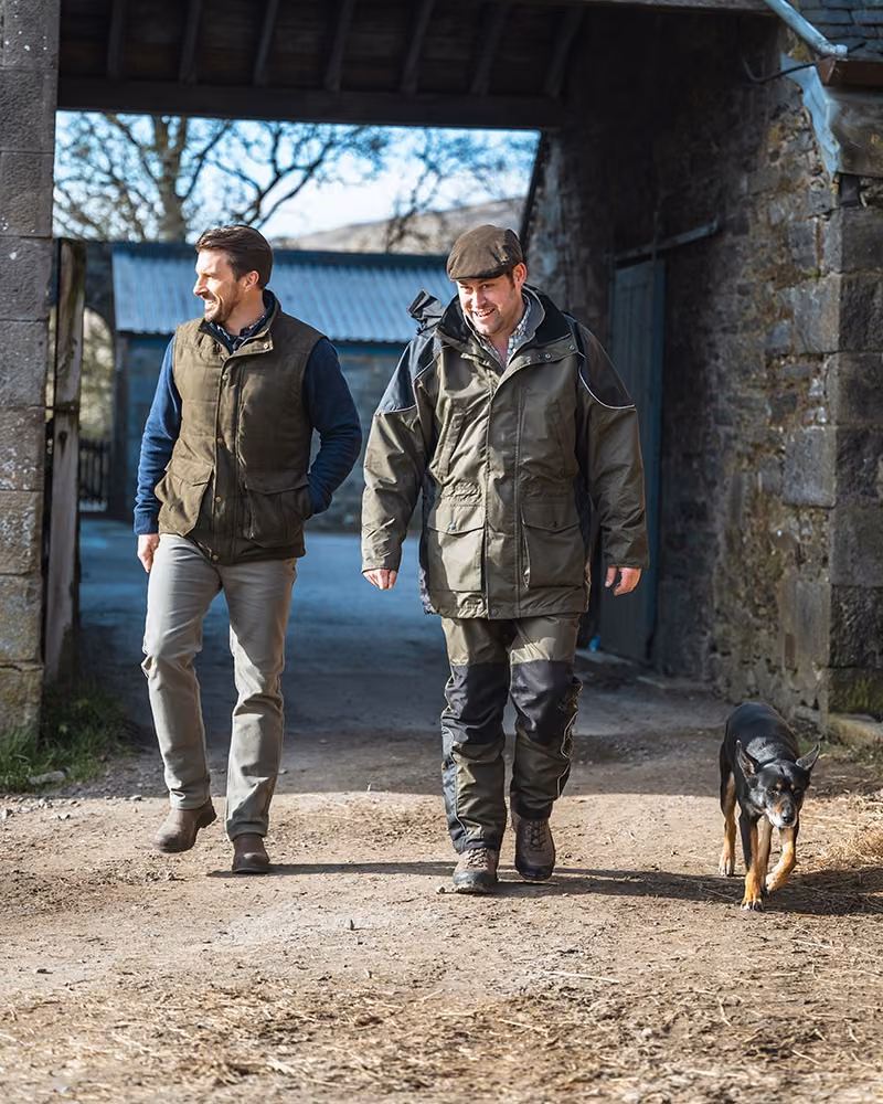 Hoggs of Fife Glenbervie Quilted Gilet in Loden, walking lifestyle view